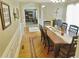 Dining room with decorative woodwork on the floor, a long table and natural light at 4895 Smokestone Dr, Douglasville, GA 30135