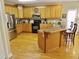 Well-equipped kitchen featuring wooden cabinets, stainless steel appliances, and a functional layout at 4895 Smokestone Dr, Douglasville, GA 30135