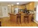 Bright kitchen with wood cabinets, stainless steel appliances, and an eat-in counter at 4895 Smokestone Dr, Douglasville, GA 30135