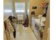 Functional laundry room with washer, dryer, utility sink, and storage, providing convenience for household chores at 4895 Smokestone Dr, Douglasville, GA 30135