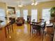 Open-concept living room with fireplace and dining area, bathed in natural light from large windows at 4895 Smokestone Dr, Douglasville, GA 30135