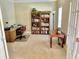 Comfortable home office featuring built-in bookshelves, a desk, and ample natural light for productivity at 4895 Smokestone Dr, Douglasville, GA 30135