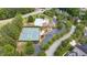 Aerial view of community amenities: pool, tennis courts, playground, and clubhouse with parking at 1634 Crittenden Ln, Lawrenceville, GA 30043