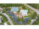 Aerial view showcasing the community pool, tennis courts, clubhouse, playground and parking at 1634 Crittenden Ln, Lawrenceville, GA 30043