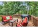 Inviting back deck with comfortable seating and a grill, ideal for outdoor entertaining and relaxation at 1634 Crittenden Ln, Lawrenceville, GA 30043