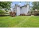 Large, well-maintained backyard with a wooden deck and ample space for outdoor activities at 1634 Crittenden Ln, Lawrenceville, GA 30043