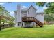 Beautiful backyard featuring a wooden deck and lush green lawn, ideal for outdoor living at 1634 Crittenden Ln, Lawrenceville, GA 30043