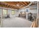 Spacious unfinished basement area with a workbench and natural light, perfect for a workshop or hobby space at 1634 Crittenden Ln, Lawrenceville, GA 30043