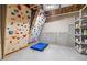 Unfinished basement transformed into a climbing gym, showcasing the space's potential for recreation and fitness at 1634 Crittenden Ln, Lawrenceville, GA 30043