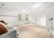 Spacious finished basement with lots of natural light, offering a versatile space for various activities at 1634 Crittenden Ln, Lawrenceville, GA 30043
