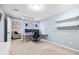Finished basement with a comfortable seating area and a well-equipped workspace, ideal for both relaxation and productivity at 1634 Crittenden Ln, Lawrenceville, GA 30043