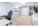 Finished basement featuring a desk, shelves and sleek entertainment center perfect for a home office or recreation room at 1634 Crittenden Ln, Lawrenceville, GA 30043