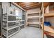 Unfinished basement area with shelving for storage and the potential to be customized to suit your needs at 1634 Crittenden Ln, Lawrenceville, GA 30043