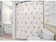 Bathroom featuring a flamingo-themed shower curtain and shelving at 1634 Crittenden Ln, Lawrenceville, GA 30043