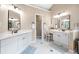 Elegant bathroom with dual sinks, vanity area, and ample natural light, creating a spa-like atmosphere at 1634 Crittenden Ln, Lawrenceville, GA 30043