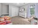 Bedroom with neutral colors, a window, and carpeted flooring at 1634 Crittenden Ln, Lawrenceville, GA 30043