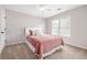 Bedroom with a plush bed, soft carpet, and abundant natural light at 1634 Crittenden Ln, Lawrenceville, GA 30043