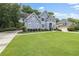 Well-maintained home featuring manicured lawn and mature landscaping at 1634 Crittenden Ln, Lawrenceville, GA 30043