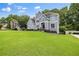 Lovely home with well-manicured lawn, mature trees, and a charming facade at 1634 Crittenden Ln, Lawrenceville, GA 30043