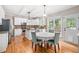 Eat-in kitchen boasts granite countertops, stainless appliances, hardwood floors, and backyard access at 1634 Crittenden Ln, Lawrenceville, GA 30043