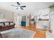 Open concept living room showcases hardwood floors, stylish furnishings, and seamless flow to kitchen at 1634 Crittenden Ln, Lawrenceville, GA 30043