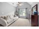 Bright living room with comfortable seating, elegant decor, and large windows showcasing natural light at 1634 Crittenden Ln, Lawrenceville, GA 30043