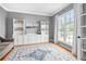 Inviting living room featuring a large window and custom built-in shelves at 1634 Crittenden Ln, Lawrenceville, GA 30043
