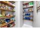 Well-organized pantry featuring wooden shelves and ample storage space for food and supplies at 1634 Crittenden Ln, Lawrenceville, GA 30043