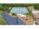 Overhead shot of well-lit tennis courts alongside a playground and neighborhood pool at 1634 Crittenden Ln, Lawrenceville, GA 30043
