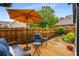 Outdoor seating area on a concrete patio with lush green landscaping at 2747 Livsey Trl, Tucker, GA 30084