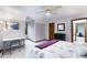 Upstairs bedroom with neutral carpet, purple walls, a work desk, and a ceiling fan at 2747 Livsey Trl, Tucker, GA 30084