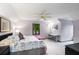 Charming bedroom with a sloped ceiling, bed, and a separate desk/study area at 2747 Livsey Trl, Tucker, GA 30084