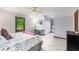 Cozy bedroom featuring light purple walls, neutral carpet, a bed, and a work desk at 2747 Livsey Trl, Tucker, GA 30084