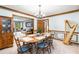 Dining area featuring harp, chandelier, with open access to living room at 2747 Livsey Trl, Tucker, GA 30084