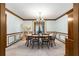 Traditional dining room boasting chandelier, classic furniture, and beautiful woodwork at 2747 Livsey Trl, Tucker, GA 30084