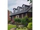 Attractive exterior view showcasing well-maintained landscaping, shutters, and dormer windows at 2747 Livsey Trl, Tucker, GA 30084