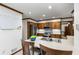 Updated kitchen with stainless steel appliances, an island with bar stool seating, and ample cabinet space at 2747 Livsey Trl, Tucker, GA 30084