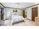Bright main bedroom featuring hardwood trim, light blue walls, carpet and an ensuite bathroom at 2747 Livsey Trl, Tucker, GA 30084