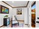 Bright sitting room with a comfortable chair, ottoman, and view of the outdoor space at 2747 Livsey Trl, Tucker, GA 30084