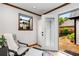 Bright sitting room with a comfortable chair, ottoman, and view of the outdoor space at 2747 Livsey Trl, Tucker, GA 30084