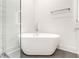 Elegant bathroom featuring a freestanding tub next to a glass shower with white marble tile at 625 Piedmont Ne Ave # 2004, Atlanta, GA 30308