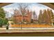 View from building entrance featuring mature trees, shrubbery, and brick building at 625 Piedmont Ne Ave # 2004, Atlanta, GA 30308