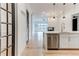 Open-concept view from the kitchen into the living space with a fireplace, showcasing modern design and seamless flow at 625 Piedmont Ne Ave # 2004, Atlanta, GA 30308