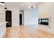 Bright living room featuring a modern fireplace, hardwood floors, and contemporary lighting fixtures at 625 Piedmont Ne Ave # 2004, Atlanta, GA 30308