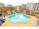 Resort-style pool with sun loungers, surrounded by lush landscaping and upscale apartments at 625 Piedmont Ne Ave # 2004, Atlanta, GA 30308