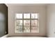 Bright room features a large window with views of a well-maintained garden and brick building at 625 Piedmont Ne Ave # 2004, Atlanta, GA 30308