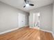 Bedroom with hardwood floors, a ceiling fan, closet, and an ensuite bathroom at 1396 Elizabeth Ln, Atlanta, GA 30344