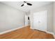 Neutral bedroom featuring hardwood floors, ceiling fan, and a closet with bi-fold doors at 1396 Elizabeth Ln, Atlanta, GA 30344