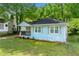 Charming single-story home with blue siding, well-maintained lawn, and cozy front porch at 1396 Elizabeth Ln, Atlanta, GA 30344