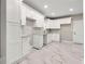 Modern kitchen features new white cabinets, updated countertops, and recessed lighting at 1396 Elizabeth Ln, Atlanta, GA 30344